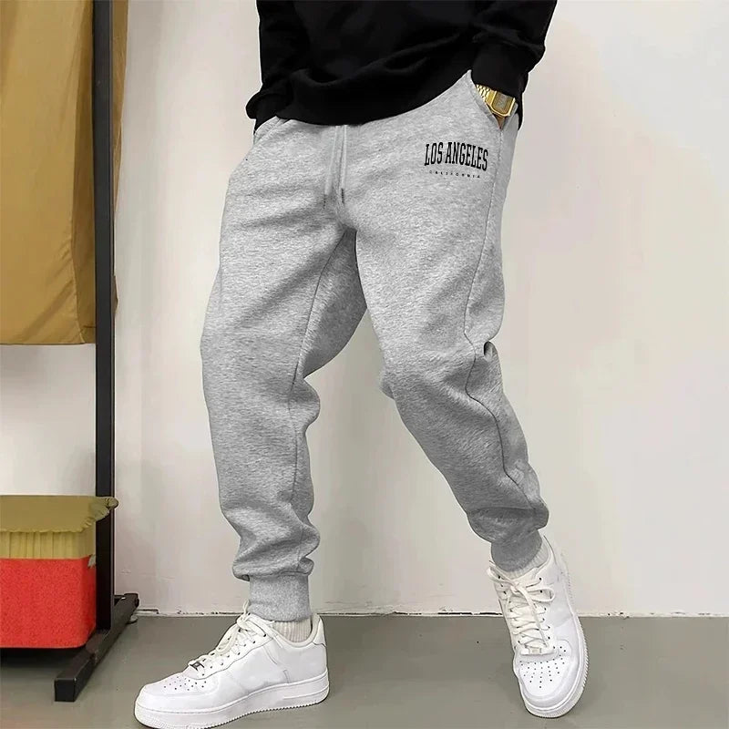 Offres spéciales hommes pantalons de survêtement impression pantalons décontractés salle de sport Fitness sport Jogging hom